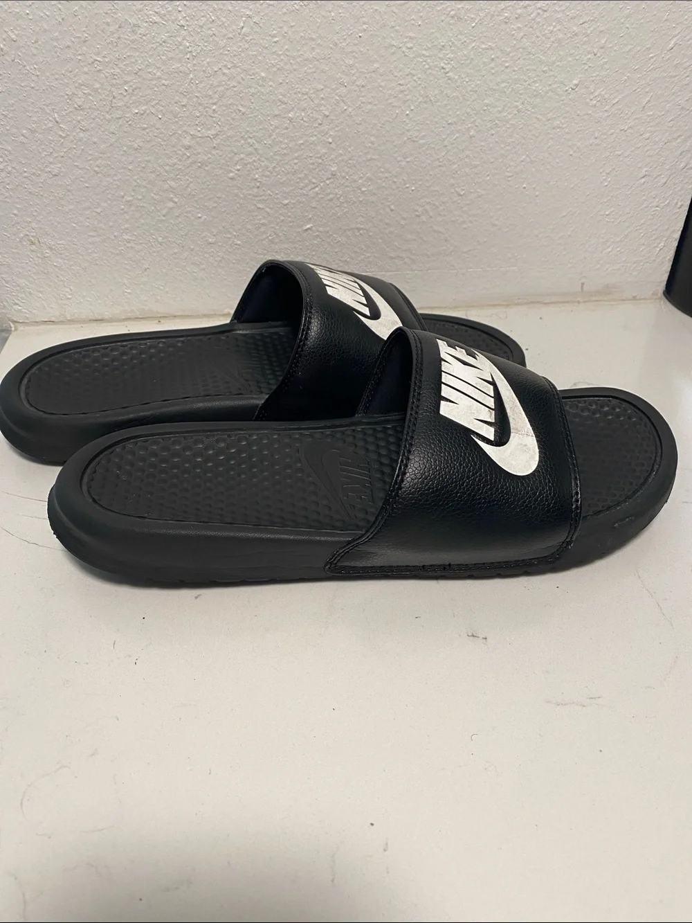 Nike Black Slide Sandals with White Swoosh Logo - Kids